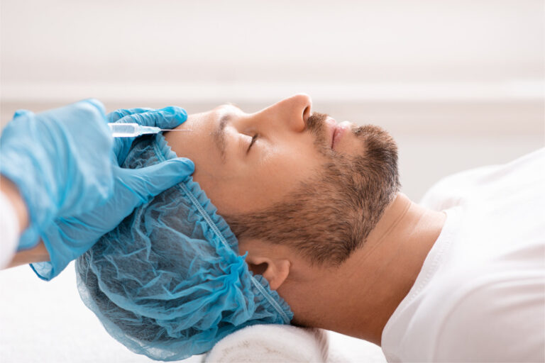 Closeup of bearded businessman getting anti-aging filler at aesthetic clinic